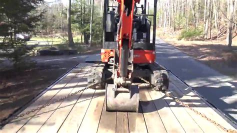 how to chain down a mini excavator|chain down a mini excavator.